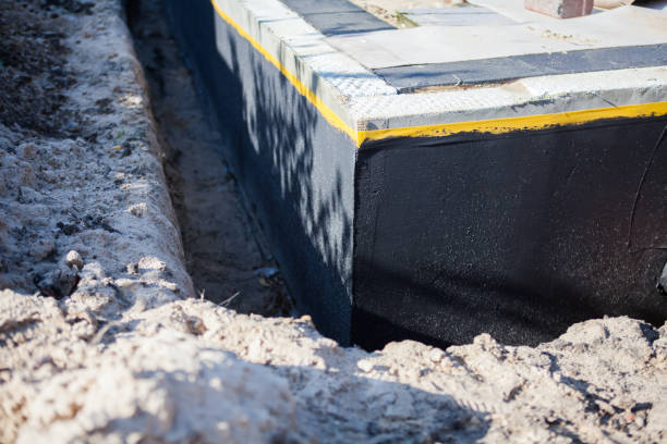 Professional Basement Waterproofing technician working in Lincoln Park, NJ